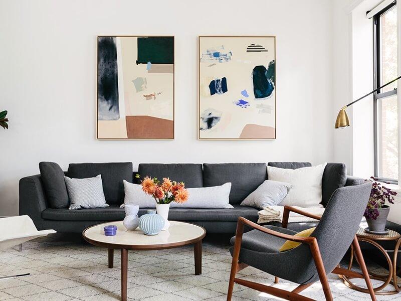 simply framed canvas float natural frame via cup of jo with art by karina bania in lexi mainland's living room